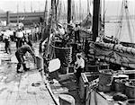 1920s 1930s COMMERCIAL FISHING SHIPPING SHIP BOAT LOADING ICE SAILING SAIL BOATING MEN WORK WORKING
