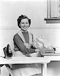 WOMAN HOUSEWORK IRONING BOARD SMILE PROUD PRIDE APRON 1940s