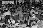 1940s SWEATSHOP WITH WORKERS SEWING