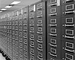 1970s ANGLED VIEW OF SERIES OF INDEX CARD FILE CABINETS ON WHEELS