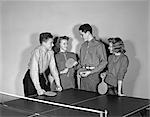 1940s TWO TEEN COUPLES BOYS GIRLS HOLD PADDLES BY PING PONG TABLE