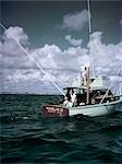 1950s Deep Sea Fishing Boat Man Pulling by Vintage Images