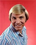 1970s HEAD SHOT BLOND MAN STRIPED SHIRT LONG HAIR STYLE HAIRSTYLE FASHION SMILING HAPPY SMILE PORTRAIT