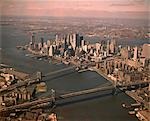 1970s AERIAL DOWNTOWN MANHATTAN LOOKING SOUTH BROOKLYN & MANHATTAN BRIDGE WORLD TRADE CENTER UNDER CONSTRUCTION