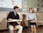 1960s TEENAGE BOY GIRL SEATED CLASSROOM DESKS TALKING