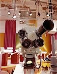 1960s CLOSE-UP FRONTAL VIEW OF MULTI LENS TELEVISION CAMERA IN STUDIO