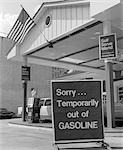 1970s SORRY TEMPORARILY OUT OF GASOLINE SIGN AT SELF SERVICE GAS STATION DURING 1973 OPEC OIL SHORTAGE CRISIS