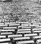 1960s AERIAL OF CROWDED STADIUM PARKING LOT WITH SEPARATE SECTIONS FOR BUSES & CARS