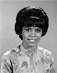 AFRICAN AMERICAN WOMAN LADY SMILE TOWARD CAMERA PRINT BLOUSE SHORT BLACK HAIR NEGRO PORTRAIT RETRO 1960s