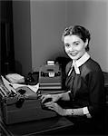1950s WOMAN SECRETARY SMILE BUSINESS TYPEWRITER