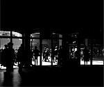 1920s 1930s SILHOUETTED PEDESTRIANS & TRAFFIC OUTSIDE THE DOORS OF GRAND CENTRAL STATION MANHATTAN NEW YORK