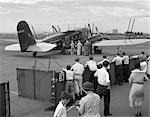 1930s PASSENGERS BOARDING AMERICAN AIRLINES CONDOR BIPLANE AIRPLANE FOR COMMERCIAL FLIGHT FROM NEWARK NEW JERSEY USA AIRPORT