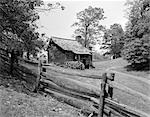 RUSTIC LOG CABIN FROM 1880s BEHIND POST & RAIL FENCE IN BLUE RIDGE MOUNTAINS