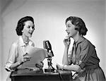 1950s TWO WOMEN DOING RADIO BROADCAST INDOOR