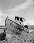 SHIPWRECK WOODEN SHIP FALLING APART ON PEBBLE SHORE BOAT NAME TRY AGAIN