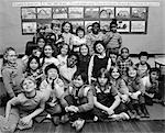 1980s GROUP PORTRAIT OF GRADE SCHOOL CLASS MAKING FUNNY FACES