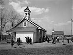 1940s 1950s ELEMENTARY SCHOOL CHILDREN AT RECESS AT RURAL ONE ROOM SCHOOLHOUSE