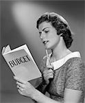 1940s WOMAN HOLDING BUDGET BOOK WITH PENCIL TO CHIN