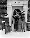 1930s 3 WOMEN FUR COATS RING DOOR BELL FRONT DOOR BRICK BUILDING SNOW WEAR HATS GLOVES BOOTS FASHION VISIT COLD