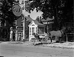 1930s HORSE & EMPTY BUGGY TIED TO POLE OUTSIDE OF GULF SERVICE STATION NEXT TO FANCY WOODEN PHONE BOOTH WITH SHINGLED ROOF