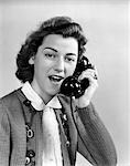 1940s 1950s YOUNG WOMAN TALKING ON TELEPHONE