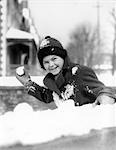 1920s 1930s SMILING BOY ABOUT TO THROW TOSS SNOWBALL PLAYING SNOW FUN WINTER COLD MISCHIEF