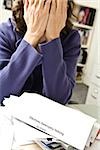Distraught woman with bankruptcy notice
