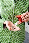 Woman emptying coins from coin purse