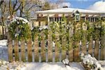 Christmas wreath on an outdoor fence