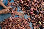 Person Chopping Up Purple Mangosteen Peels