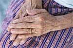 Close-up of Elderly Woman's Hands Folded in Her Lap, Sri Prachan Market, Suphanburi, Thailand