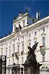 Statue of battling titans in foreground, Archbishops's Palace, Prague, Czech Republic, Europe