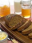 Whole Grain Bread With Honey, Milk, Marmalade and Butter