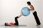 Couple working out with exercise ball