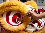 Person painting Chinese lion costume