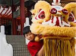 Little boy with Chinese lion dance costume