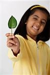 Girl holding leaf