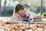 Mother and Baby Outdoors in Autumn