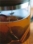 Tea strainer steeping in glass