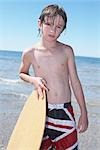 Boy Skimboarding at Deanlea Beach, Elmvale, Ontario, Canada