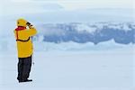 Tourist Using Binoculars, Snow Hill Island, Antarctica