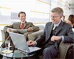 Business People Waiting in Airport Lounge