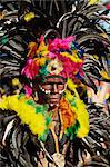 Portrait of a man with facial decoration and head-dress with feathers at Mardi Gras carnival, Dinagyang in Iloilo City on Panay Island, Philippines, Southeast Asia, Asia