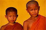 Portrait of two young monks during Buddhist Lent in Vientiane, Laos, Indochina, Southeast Asia, Asia