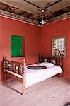 Traditional mud floor contrasting with the magnificently painted ceiling in restored traditional Pol house, Ahmedabad, Gujarat state, India, Asia