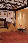 Colonial style bed and traditional chic blinds at window in residential home, Dehra Dun, Himalayan foot hills, Uttar Pradesh state, India, Asia