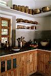 Traditional brass kitchen utensils in kitchen area in residential home, Amber, near Jaipur, Rajasthan state, India, Asia