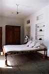 Bedroom with traditional low slung bed or charpoy in a home in Amber, near Jaipur, Rajasthan state, India, Asia