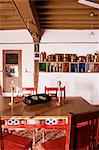 Wood beamed ceiling and kitchen utensils on wall in dining area in restored traditional Pol house, Ahmedabad, Gujarat state, India, Asia