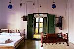 Bedroom with traditional hitchkar suspended swing seat in restored traditional Pol house, Ahmedabad, Gujarat state, India, Asia